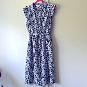 Knee length white and blue flowered summer dress with pockets